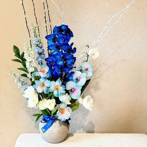 Frozen Orchids Arrangement with White and Blue Tulips in a Vase